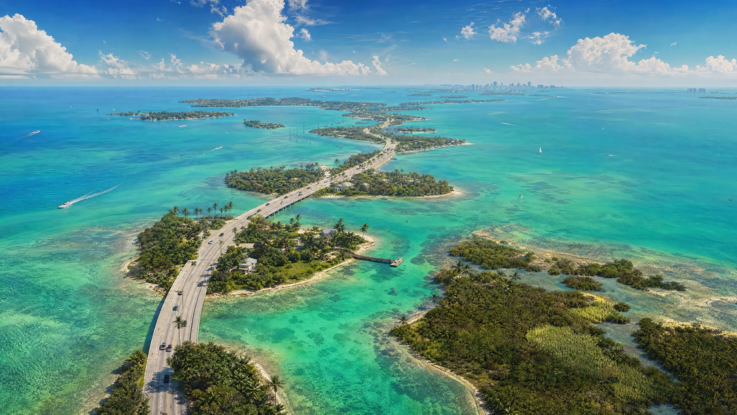 An illustration we made of a chain of low green islands in turquoise shallows seen from the air at midday, a causeway threading from one to the next.